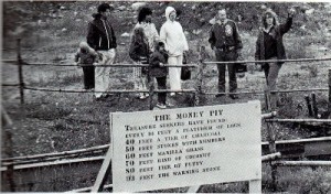 Early tourists gather around the Money Pit