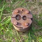 Metal cap of a drill hole, Oak Island