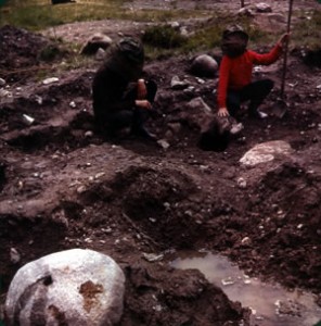 Rick & Mom (wearing bug gear)with Rick pointing to a dome of stones discovered over a shaft approximately 18" by 31 ft. deep, constructed by whomever did the original work on the Island.