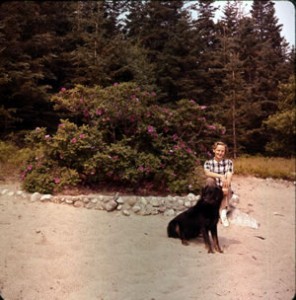 Mom and Carney in front of Oak Island's famous rosebush.